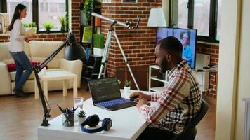 Male programmer developing an app on his laptop and working remotely. Home office setup includes digital tools and focuses on software engineering and coding, IT specialist. Camera A. video