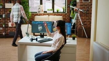 Asian woman engineer creating prototypes with vr glasses and 3D modeling software, working from home to develop new manufacturing gears and turbines. 3D design tech tools. Camera A. video
