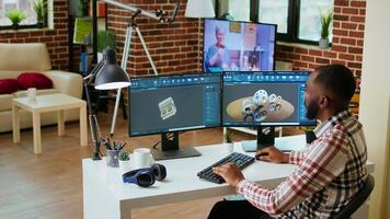 African american industrial designer works on prototypes in a creative studio. Doing tech driven remote work with 3D modeling and CAD software, industrial tools for technical precision. Camera A. video