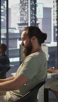 Vertical Developer working with artificial intelligence machine learning tech, improving company systems. IT expert in office focused on transforming data into predictive models, camera B video