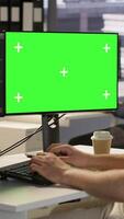 Vertical Computer scientist using isolated screen PC to create machine learning models that can process data to automate decision making processes. IT specialist programming using chroma key computer, camera A video