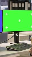 Vertical Employee using multi monitor isolated screen computer to analyze datasets, comparing accounting figures. Woman using chroma key PC to solve tasks for team project, camera A video