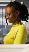 Vertical System administrator creating machine learning models that can process and analyze data to automate decision making processes. IT staff member using laptop to do programming in office, camera A video