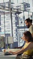 Vertical IT employee coding in programming languages to construct algorithms and build applications. Software technician developing and maintaining databases and data structures in office, camera B video