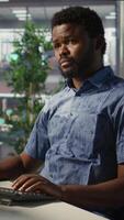 Vertical Data scientist developing and maintaining machine learning APIs solving complex problems. Man training predictive models capable of handling tasks such as language processing, camera B video