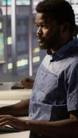 Vertical Data scientist working with machine learning artificial intelligence technology critical to autonomous systems. IT professional working with AI tech to transform data into predictive models, camera A video