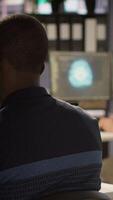 Vertical Programmer creating AI machine learning models that can analyze data to automate decision making processes, handheld camera shot. IT professional doing artificial intelligence programming, camera A video