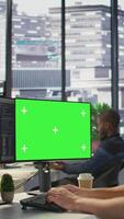Vertical Computer scientist using isolated screen PC to create machine learning models that can process data to automate decision making processes. IT specialist programming using chroma key computer, camera B video