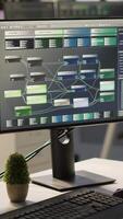 Vertical Empty IT department office used for building artificial intelligence machine learning software technology. Bright modern company workspace with nobody in and devices left open on desks video