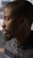 Vertical System administrator doing software quality assurance, checking source code on tablet. Close up of african american IT specialist at work inspecting coding on device, looking to fix errors, camera A video
