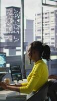 Vertical Computer scientist testing AI company software, identifying errors in machine learning tech. African american IT staff member writing artificial intelligence code in programming language, camera B video