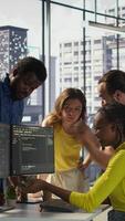 Vertical IT staff members arguing, having different ideas while testing and deploying programs and systems. Team of programmers fighting in office while checking code, having disagreement, camera B video