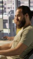 Vertical Developer working with artificial intelligence machine learning tech, improving company systems. IT expert in office focused on transforming data into predictive models, camera A video