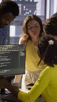 Vertical IT staff members arguing, having different ideas while testing and deploying programs and systems. Team of programmers fighting in office while checking code, having disagreement, camera A video