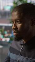Vertical Portrait of happy programmer working with machine learning artificial intelligence critical to autonomous systems. Upbeat software engineer transforming data into predictive models, camera A video