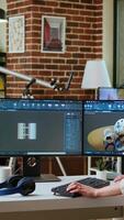 Vertical Expert engineer develops industrial prototypes using 3D modeling software at her home office, featuring dual monitors and modern office equipment perfect for innovative design processes. Camera A. video