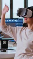 Vertical Asian woman engineer creating prototypes with vr glasses and 3D modeling software, working from home to develop new manufacturing gears and turbines. 3D design tech tools. Camera B. video