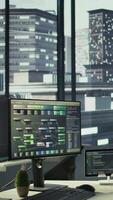 Vertical Programming language on digital devices screen in empty IT department office used for app development. Panning shot of tablet and PC left open on desk in tech startup company workspace with nobody in video