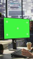 Vertical Computer scientist working, doing software debugging using mockup PC, troubleshooting errors. Woman in office fixing coding issues using green screen computer, solving tasks, camera B video