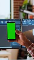 Vertical Software developer creates a gear prototype on dual monitors next to chroma key display, home office remote work. Expert does 3D modeling for innovation in the industrial design industry. Camera B. video