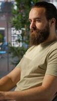 Vertical Meticulous staff member imputing data on computer in office. Adept worker at desk focused on typing company statistical numbers, working hard to finish job before deadline, camera A video