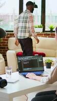 Vertical Asian freelancer woman works on programming code in a modern office at home, using her laptop for computer science. IT specialist supports coding, web development and digital innovation. Camera A. video
