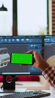 Vertical Male freelance designer works remotely on 3D prototypes using green screen and CAD software. Home workspace highlights the balance between productivity and comfort in industrial design. Camera B. video