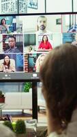 Vertical Diverse team of workers reviewing project updates together with shareholders on call online meeting, ensuring easy remote collaboration for global business expansion plans. Teamwork. Camera B. video