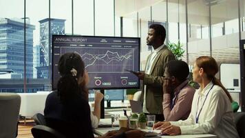 The CEO and management team gathering in boardroom for a project briefing, focusing on enterprise solutions and aligning with the company strategic goals. Discussing budget plans. Camera B. video