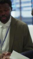 Vertical Enterprise manager works with his staff on creating a business strategy and setting goals, studying market dynamics and sales numbers. Corporation team attends a development meeting. Camera A. video