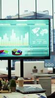 Vertical High end business office with a computer displaying detailed analytics, perfect for executive company meetings or financial planning and project development in a multinational corporation. video