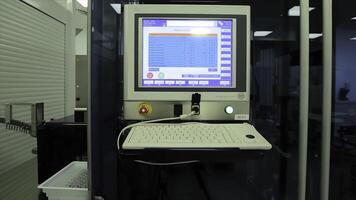 Computer in laboratory or manufactory. Biochemical analyzer and computer in laboratory of wine industry. Analyzing data scientist in the laboratory with a screen project development researcher photo