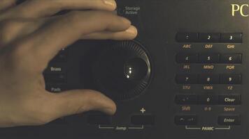 Hand tuning fm radio button. Retro image processed. Hand adjusting volume control. Broadcasting and music concept. woman turning button of radio in car. Woman hand adjusting volume control. photo