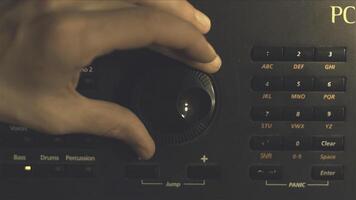 Hand tuning fm radio button. Retro image processed. Hand adjusting volume control. Broadcasting and music concept. woman turning button of radio in car. Woman hand adjusting volume control. photo