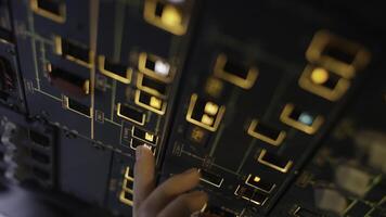 Autopilot control element of an airliner. Panel of switches on an aircraft flight deck. Thrust levers of a twin engined airliner. Pilot controls the aircraft. Onboard computer, cockpit photo