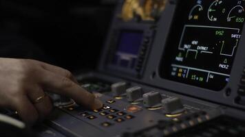 Autopilot control element of an airliner. Panel of switches on an aircraft flight deck. Thrust levers of a twin engined airliner. Pilot controls the aircraft. Onboard computer, cockpit photo