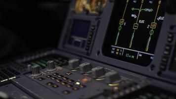 Autopilot control element of an airliner. Panel of switches on an aircraft flight deck. Thrust levers of a twin engined airliner. Pilot controls the aircraft. Onboard computer, cockpit photo