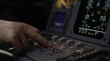Autopilot control element of an airliner. Panel of switches on an aircraft flight deck. Thrust levers of a twin engined airliner. Pilot controls the aircraft. Onboard computer, cockpit photo