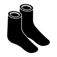 A solid design icon of shoes vector