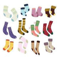 Socks. Set cozy different winter and autumn socks. Warm seasonal clothes. Flat illustration on a white background. vector