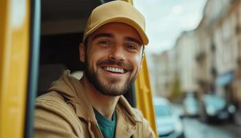 A smiling man in a yellow hat sitting in a van photo