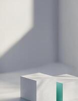 Three white cubes on a table with a blue square photo