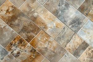 A tile floor with a brown and gray pattern photo