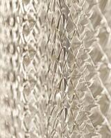 A shiny, reflective surface with a pattern of squares and diamonds photo