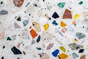 Mosaic tile floor with a variety of colored stones. Geometric flooring design. photo