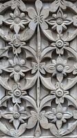 A beautiful, intricate design of flowers and leaves photo