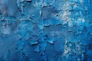 A blue wall with a lot of cracks and peeling paint photo