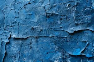 Blue wall with cracks and peeling paint. Grunge texture background for design projects. photo