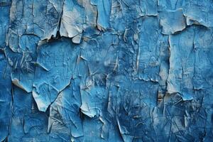 Cracked blue wall with peeling paint. Distressed urban texture background concept. photo