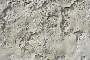 Peeling paint and dirt on a wall. Distressed urban texture background concept. photo